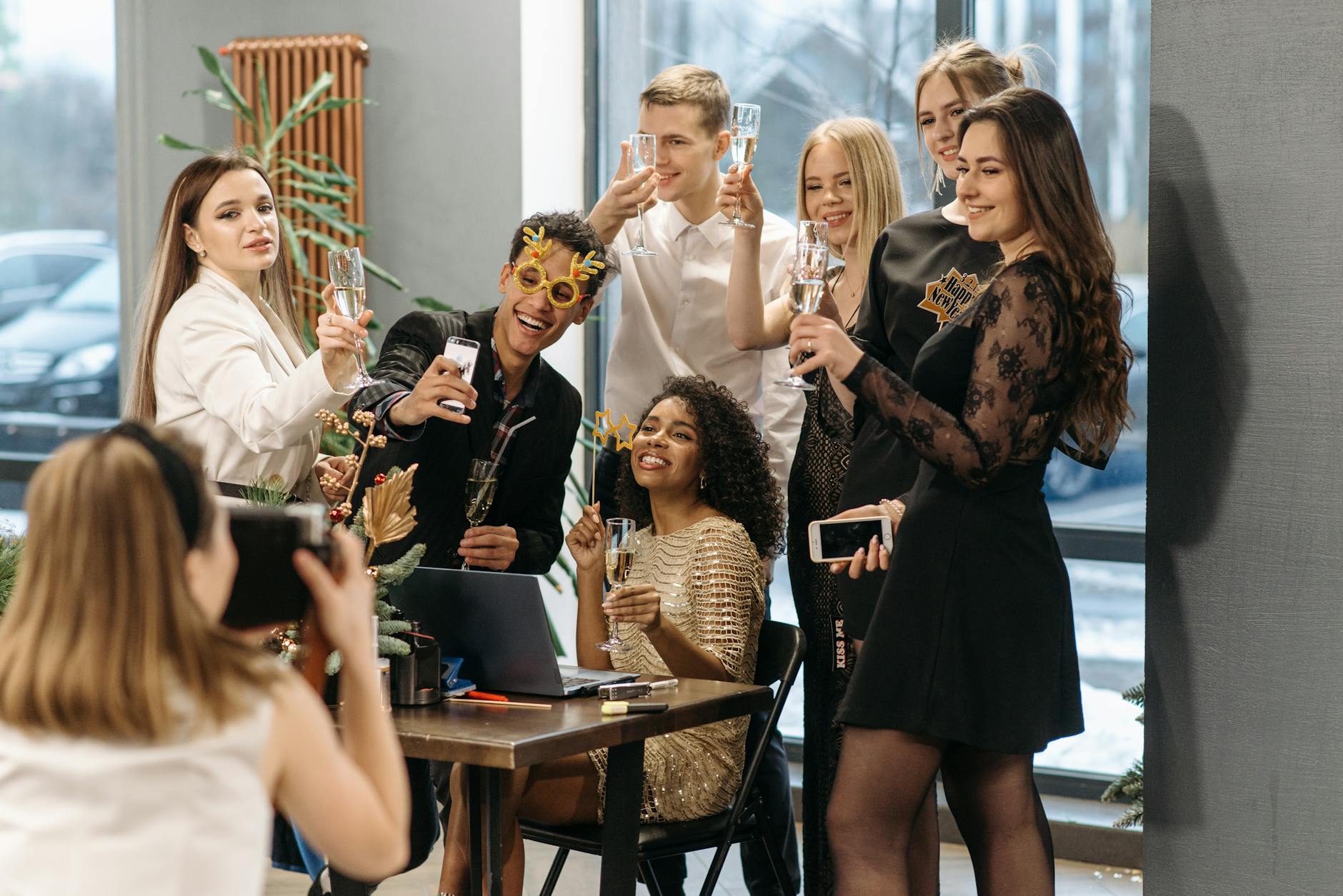 https://www.pexels.com/photo/a-group-of-people-in-the-party-having-a-group-photo-6405729/