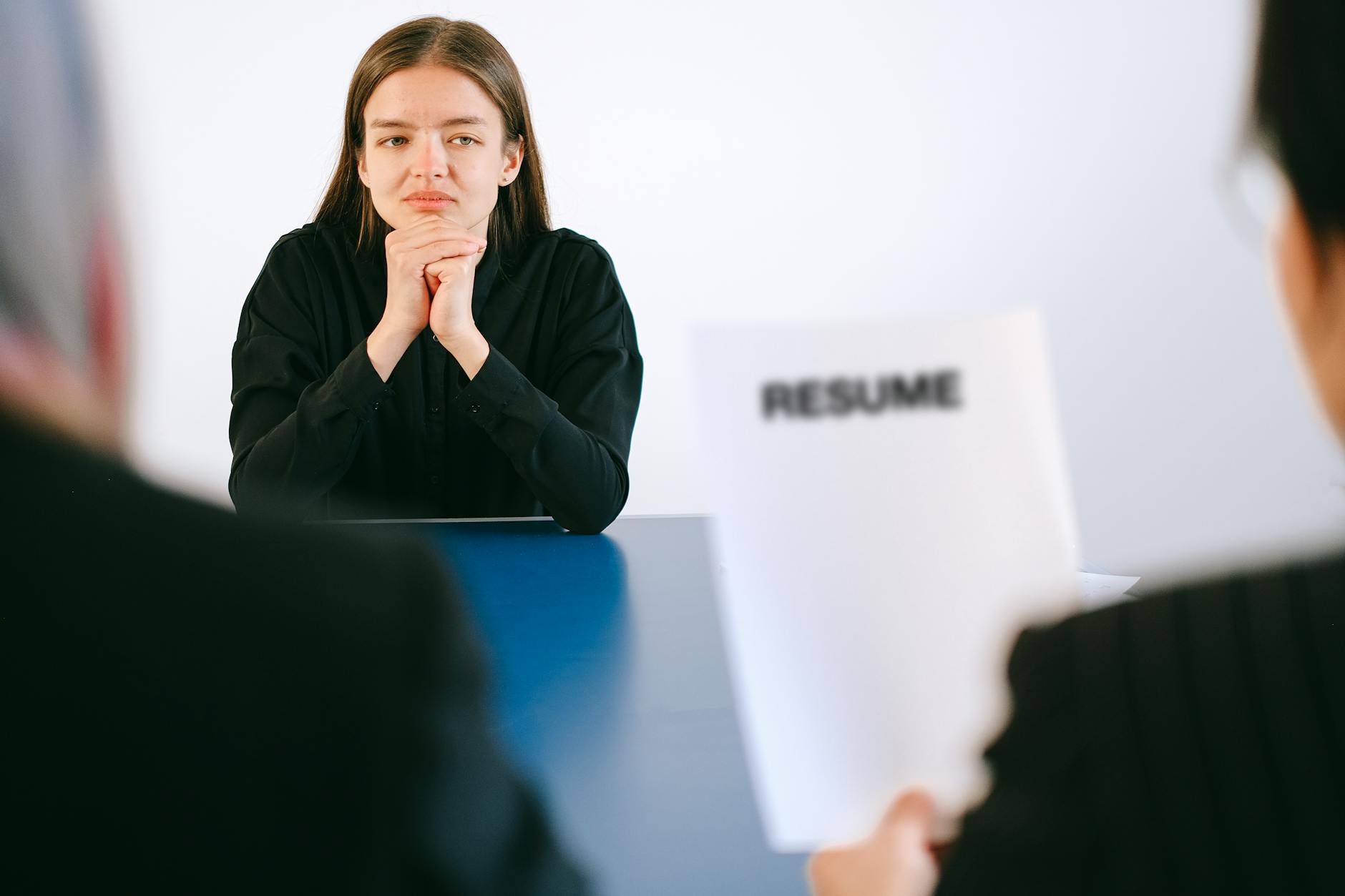 https://www.pexels.com/photo/woman-in-black-long-sleeve-shirt-sitting-having-interview-4226115/