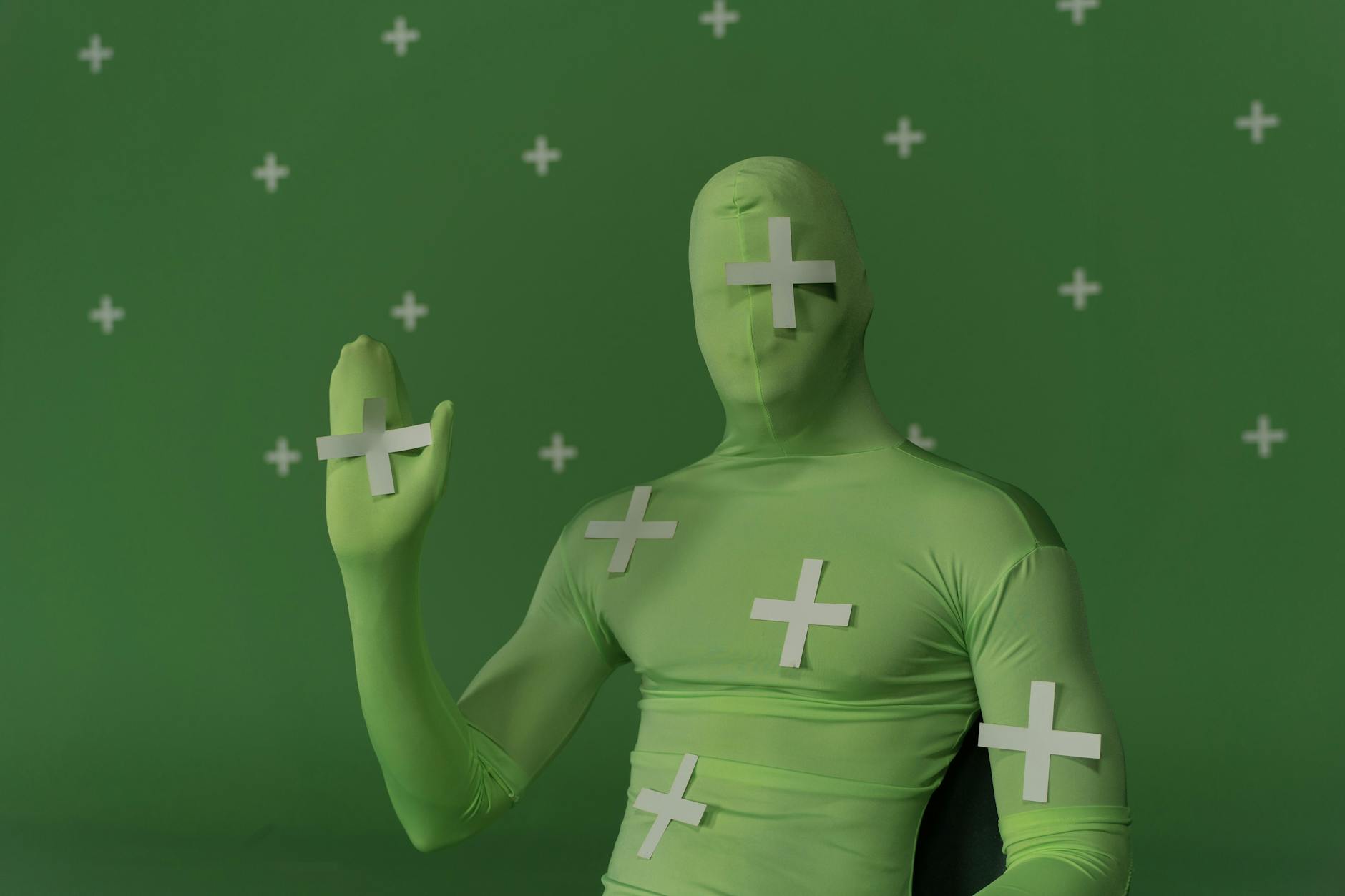 https://www.pexels.com/photo/a-person-wearing-a-green-costume-9488228/