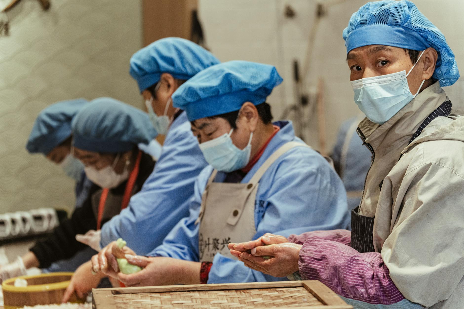 https://www.pexels.com/photo/workers-making-dumplings-in-a-kitchen-setting-35244397/