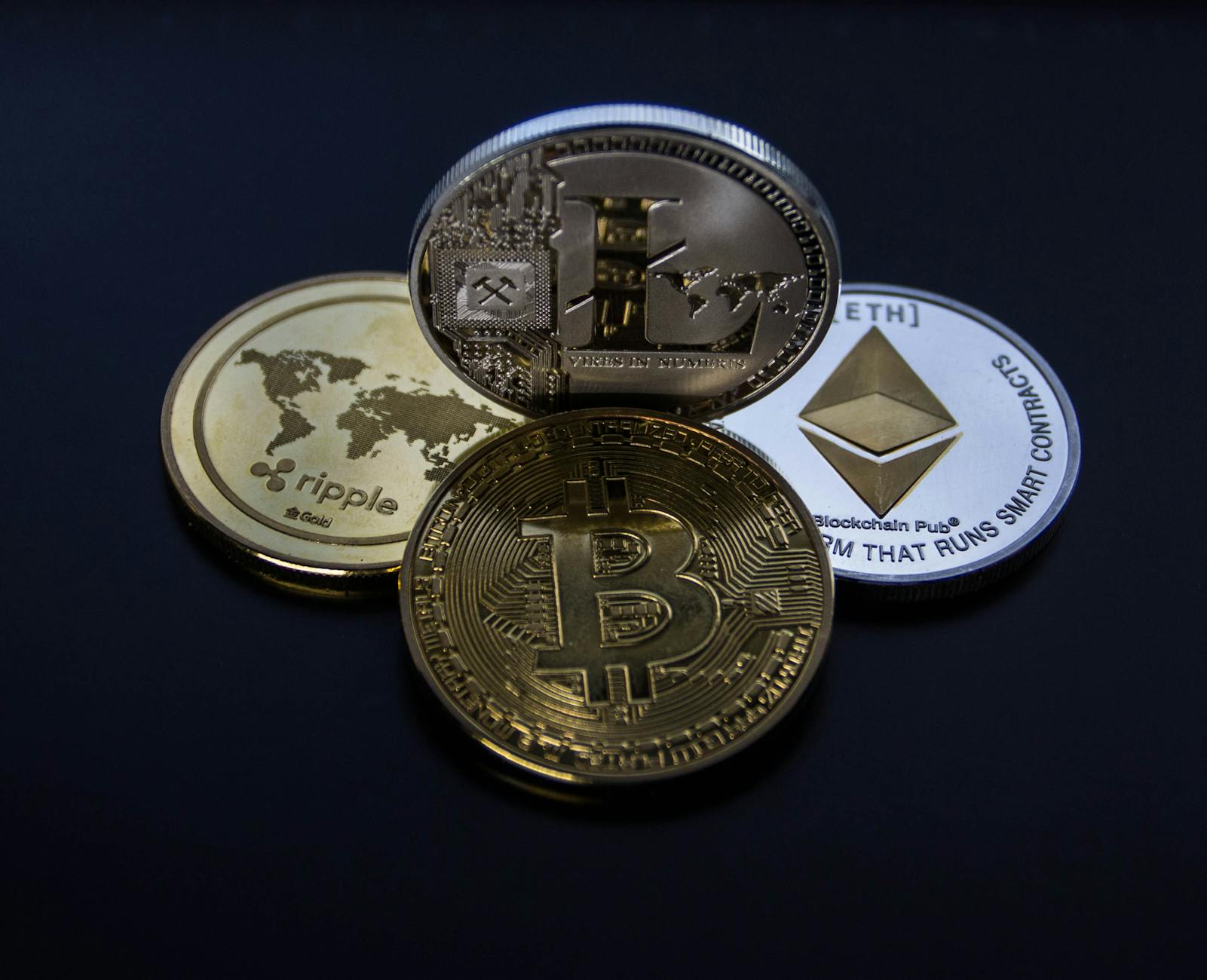 https://www.pexels.com/photo/four-assorted-cryptocurrency-coins-843700/