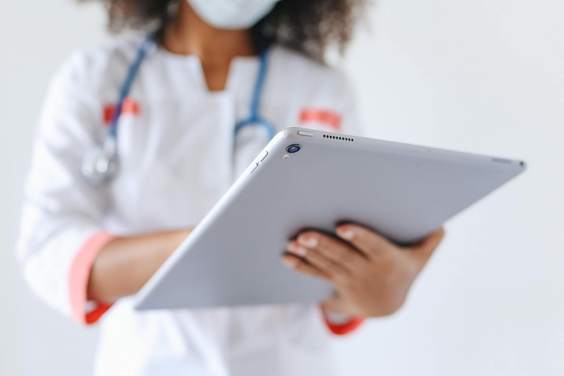 https://www.pexels.com/photo/person-wearing-a-face-mask-holding-an-ipad-5234499/