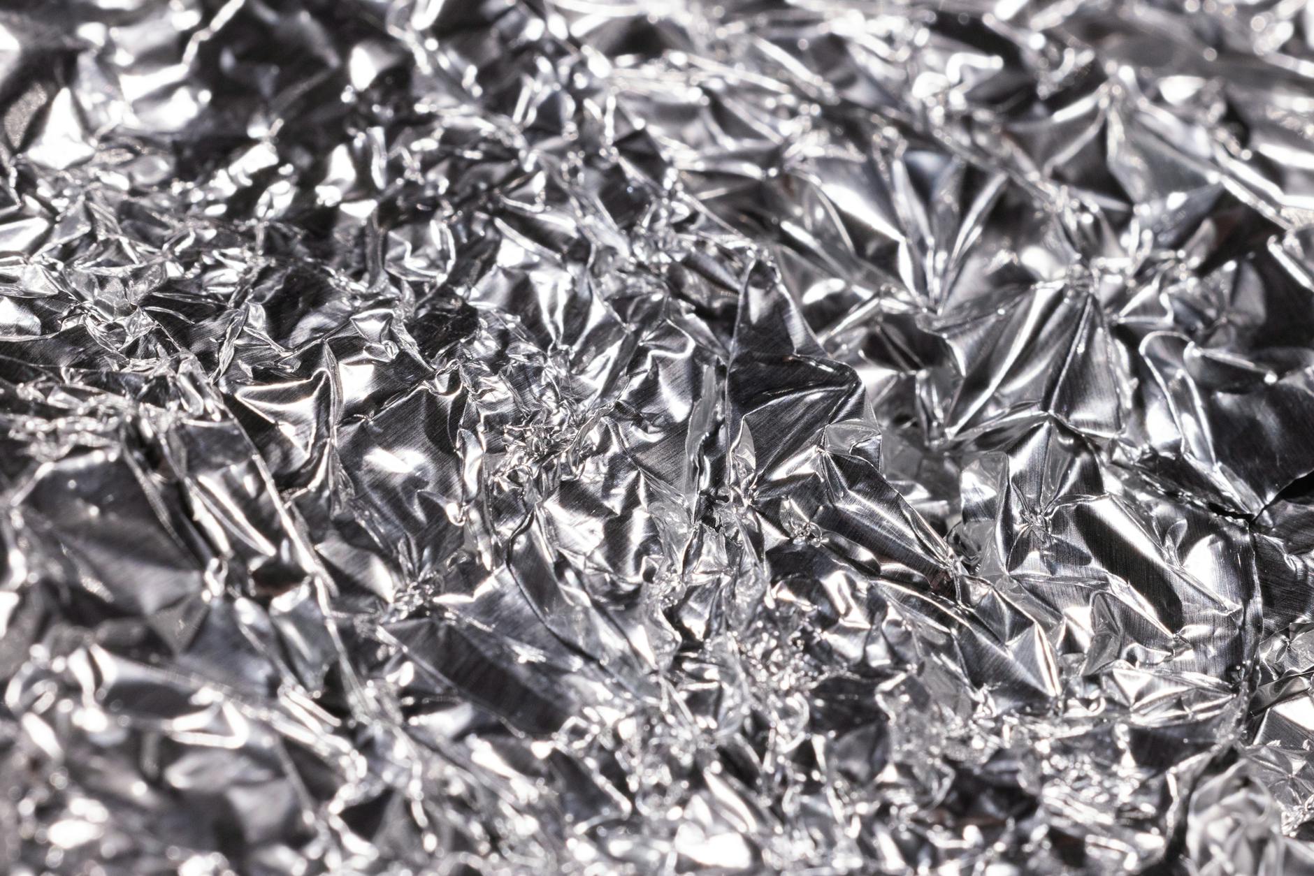 https://www.pexels.com/photo/a-close-up-shot-of-a-crumpled-aluminum-foil-10221748/