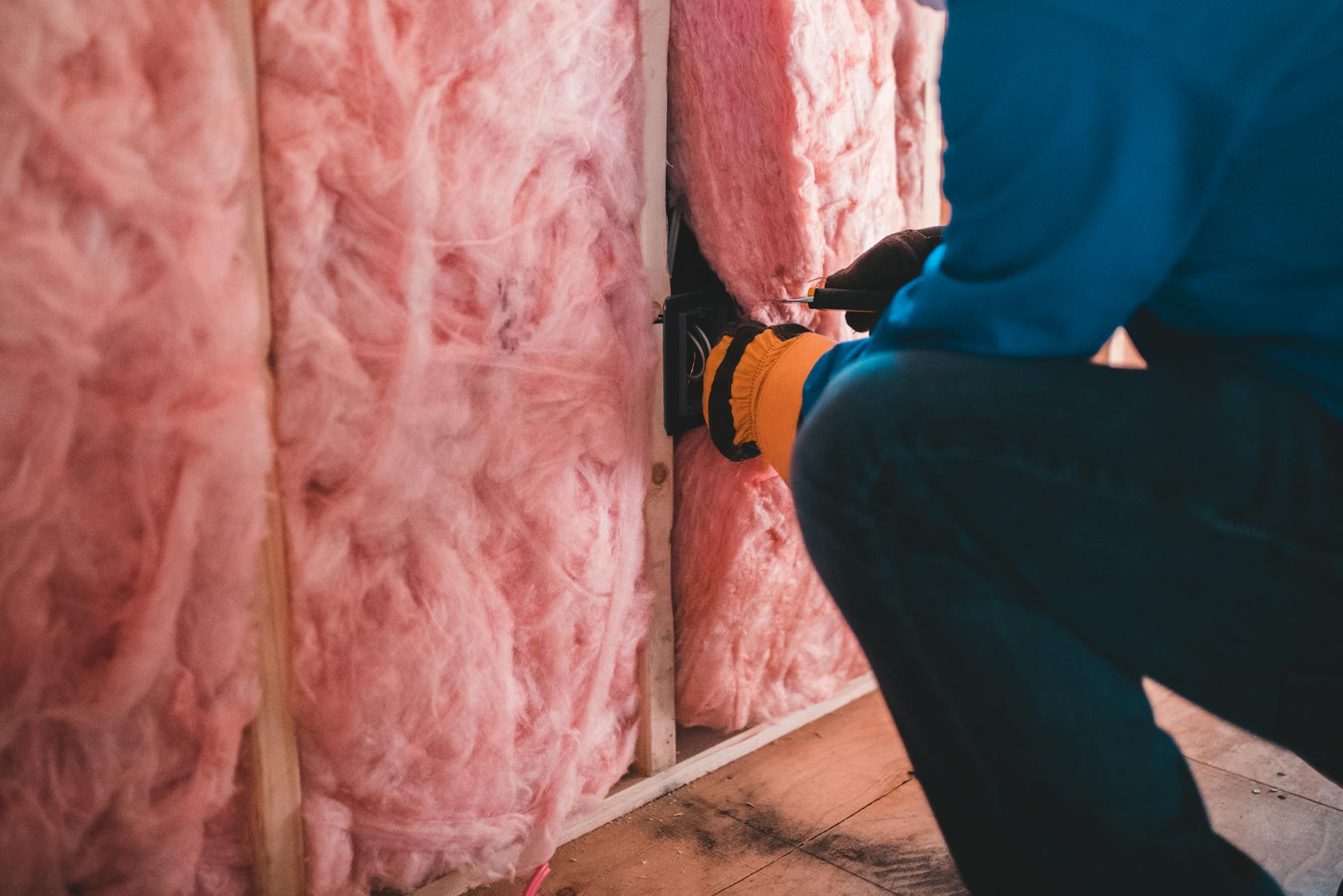 https://www.pexels.com/photo/unrecognizable-worker-insulating-with-stone-wool-6124239/